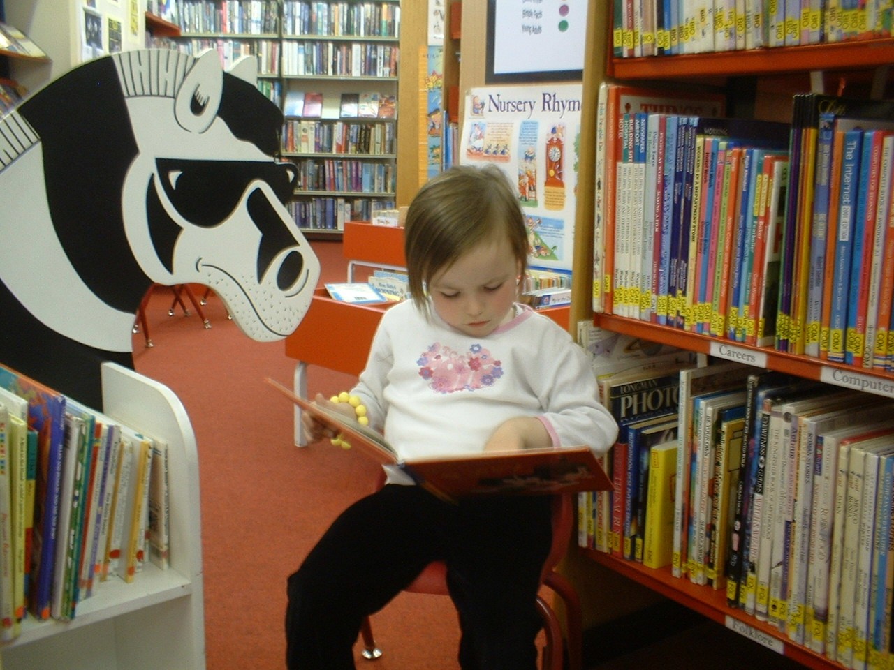 A child reading a book at Kilkenny Library